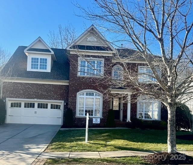 Exterior view of a two-story house with a prominent front-facing garage, lush green lawn, and a 'Coming Soon' sign in the yard, representing new houses for sale in Rock Hill SC.