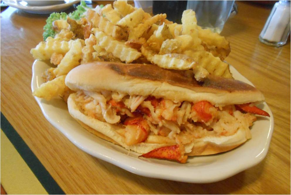 A platter of two hot dogs, french fries, and a salad at Jimmies of Savin Rock.