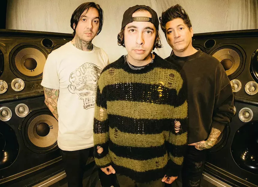 Pierce the Veil band members in concert