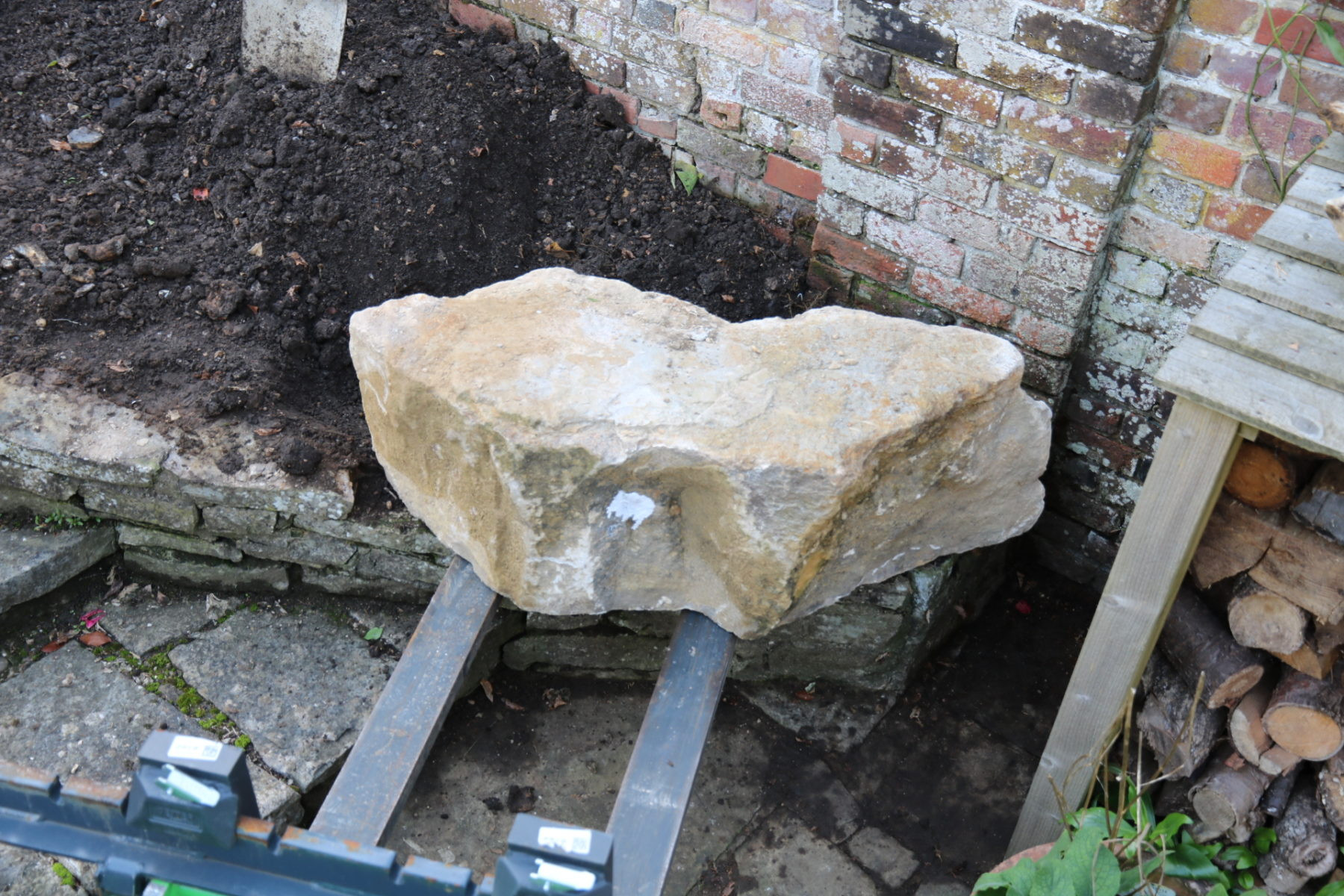 Placing the first keystone rock