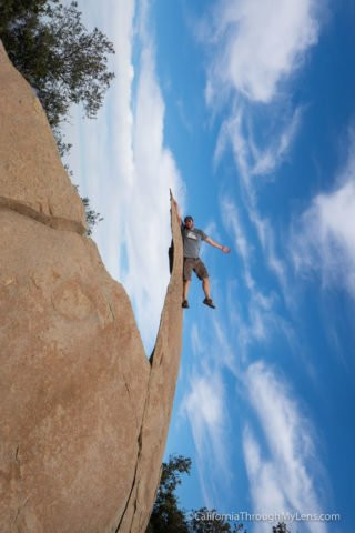 Popular photo pose on Potato Chip Rock, showcasing the wafer-thin appearance and the adventurous spirit of hikers in Poway.