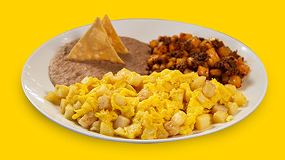 Classic potato and egg breakfast plate at Taco Palenque Round Rock, with potatoes, eggs, beans, and chorizo potatoes.