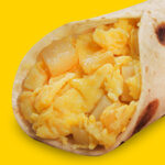 Classic potato and egg breakfast taco at Taco Palenque Round Rock, featuring golden brown potatoes and scrambled eggs.