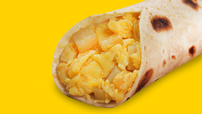 Classic potato and egg breakfast taco at Taco Palenque Round Rock, featuring golden brown potatoes and scrambled eggs.