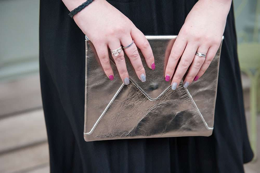 Close up of the metallic clutch and retro dress details