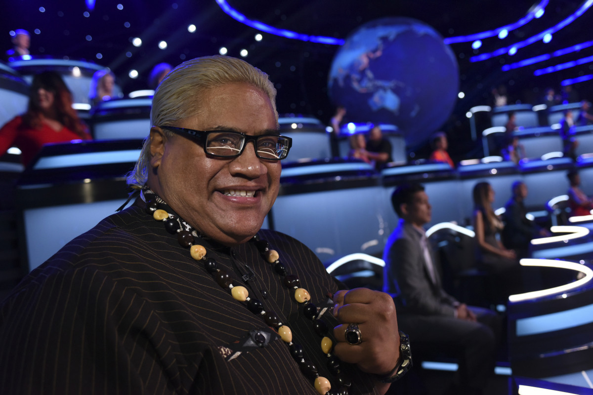 Rikishi smiling gesturing to crowd during wrestling match