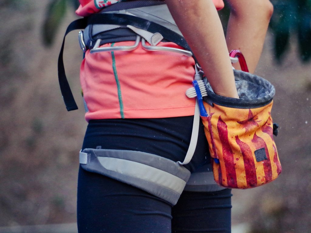 Chalk bag and chalk, essential for improving grip in climbing