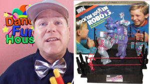 Neil Dandy showcasing a vintage &quot;Outer Space&quot; version of Rock 'Em Sock 'Em Robots, demonstrating the toy's adaptability and enduring appeal through themed variations.