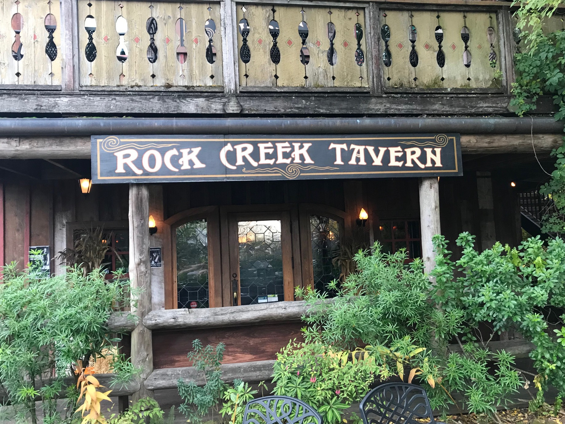 The Rock Creek tavern main sign is easy to spot from the street - while most of the structure except the fireplace is wooden - adding to the vintage feel and esthetic