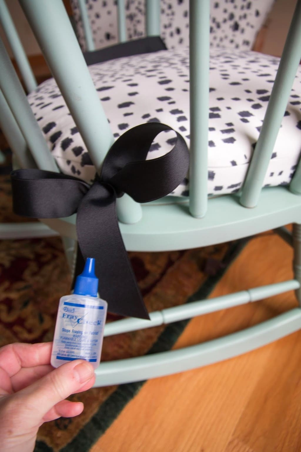 Rocking chair cushions with decorative ribbon detail, showcasing the aesthetic detail of ribbon accents