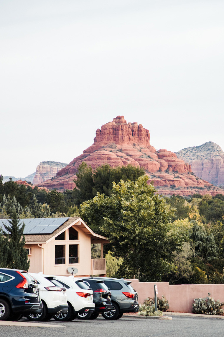 Panoramic view from Hilton Sedona Resort at Bell Rock parking area showcasing red rock formations