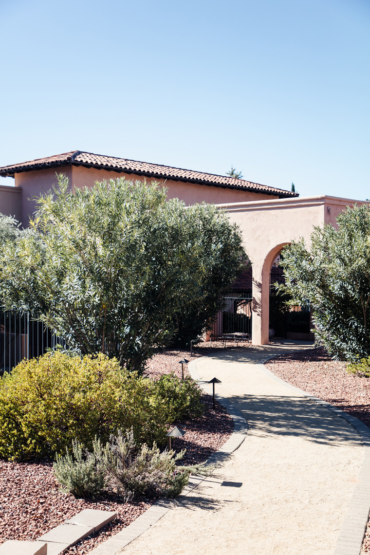 Tranquil path leading to the spa building at Hilton Sedona Resort at Bell Rock, hinting at the relaxing experience within