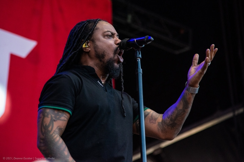 Lajon Witherspoon of Sevendust singing at Blue Ridge Rock Festival Day 2. The Sevendust vocalist is delivering a powerful and emotional performance on stage.