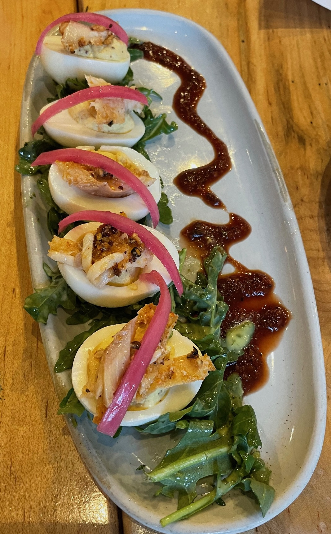 Deviled eggs with smoked trout and pickled onions at Speckled Trout