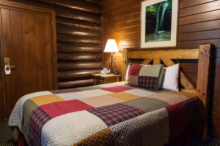 Interior of a Sunset Cabin Full Bed room with a full-size bed