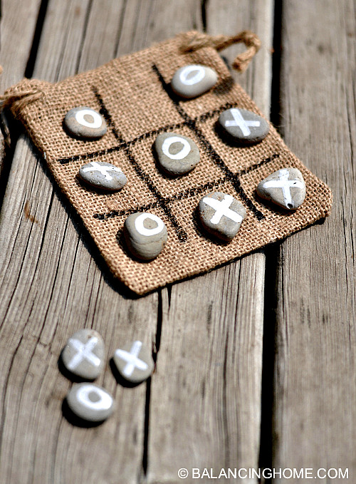 Creative uses for painted rocks: tic-tac-toe game and kindness rocks.