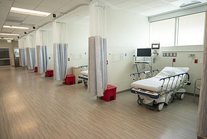 A brightly lit and open waiting area in the UAMS Orthopaedic &amp; Spine Hospital, designed to accommodate many patients and visitors comfortably.