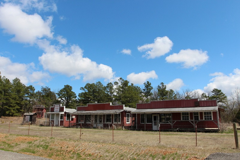 The weathered facade of the abandoned Booger Hollow Trading Post along Scenic Highway 7