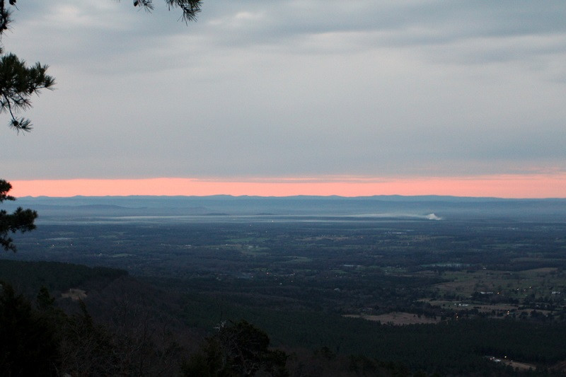 Sunrise casting warm light over the Arkansas landscape from Mount Nebo State Park