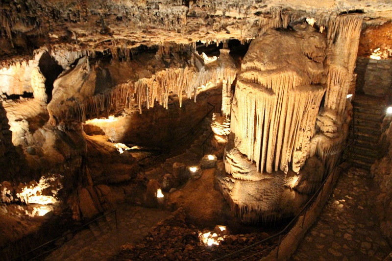 Intricate stalactite formations within Crystal Dome cave, illuminated to reveal their beauty