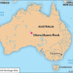 Panoramic view of Uluru (Ayers Rock) and the surrounding desert landscape in Uluru-Kata Tjuta National Park, Australia.