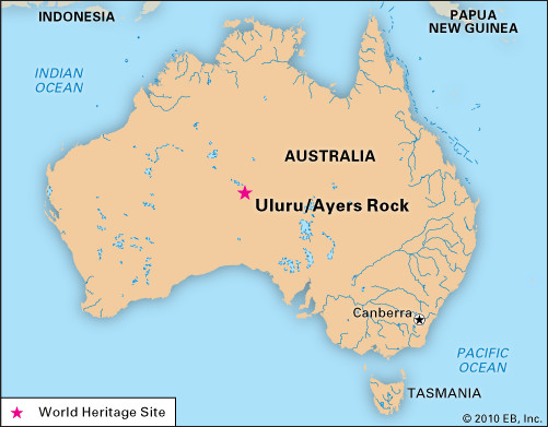 Panoramic view of Uluru (Ayers Rock) and the surrounding desert landscape in Uluru-Kata Tjuta National Park, Australia.