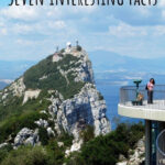 Panoramic view of the Rock of Gibraltar from afar, showcasing its imposing size and strategic coastal location.