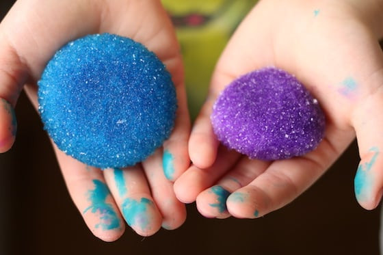 Child holding stones crystalized with borax and hot water