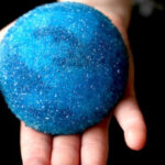 large beach stone covered with blue borax crystals