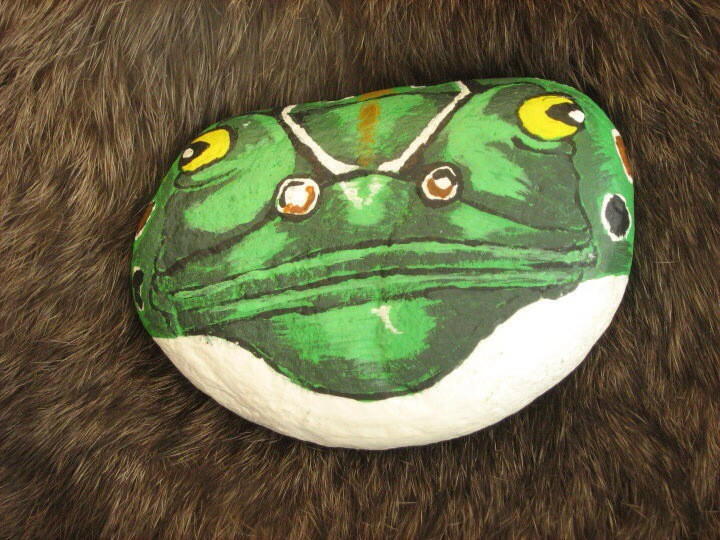 Painted river rocks featuring colorful animal designs