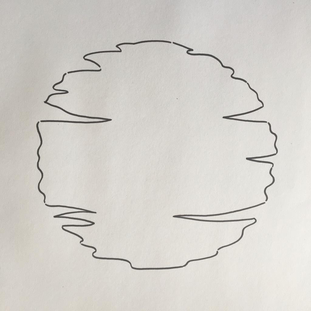 Drawing paper with a pencil sketch of sun shape