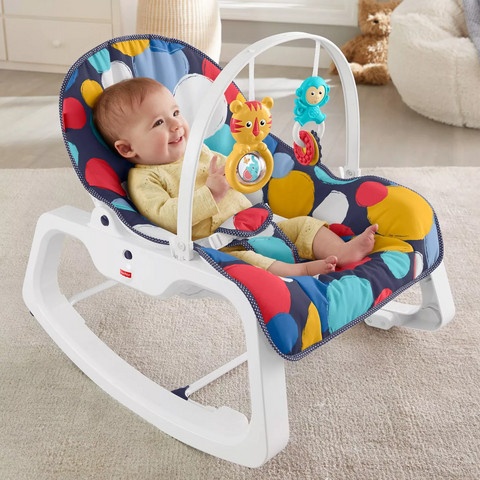 Baby playing in baby rocker