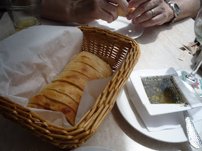 Hot, crusty Ciabatta Bread with Herb-Infused Olive Oil, a delightful appetizer at Guppy's On The Beach.