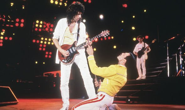 Brian May performing with Queen, inspired by a unifying audience experience