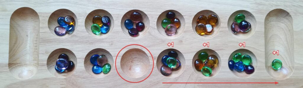 Assortment of smooth river rocks in various sizes and colors, ideal for use as Mancala stones