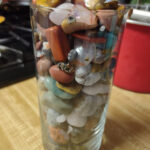 Rough rocks ready for tumbling in a National Geographic rock tumbler barrel.