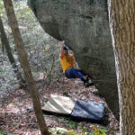 Man bouldering at Rimrock PA WIlds, showcasing the rugged beauty of natural landscapes