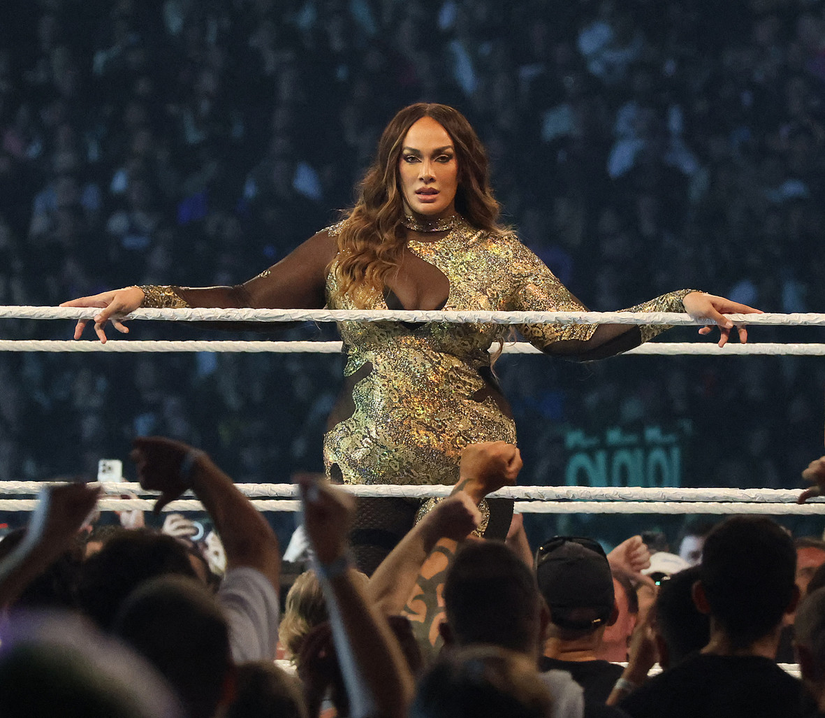 Nia Jax, pictured here during her match against Rhea Ripley at the WWE Elimination Chamber at Optus Stadium, in Perth, Western Australia, on February 24, 2024, showcasing the intensity of their wrestling careers and family connection