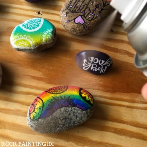 Sealing painted rocks with the correct techniques protects them from the elements ensuring they stay beautiful for years. #rockpainting101