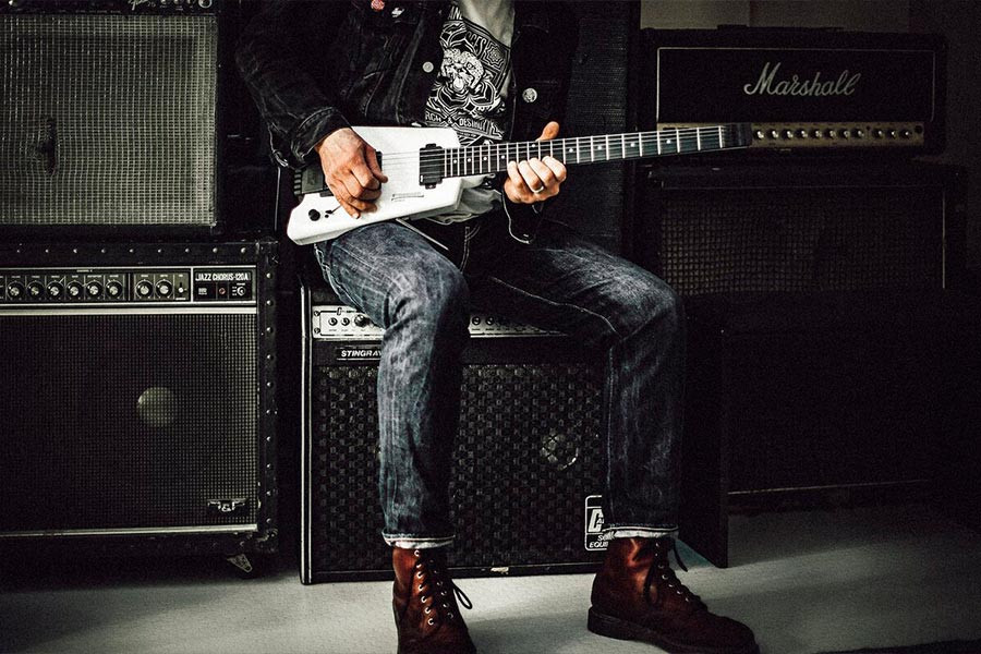 Person playing an electric guitar