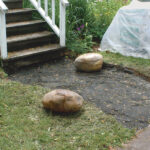 Dig a level base, then add well-tamped crushed gravel. The depth of the base depends on the climate