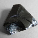 Volcanic glass, obsidian, with conchoidal fracture due to rapid cooling