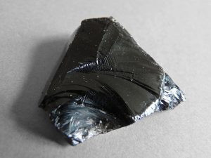 Volcanic glass, obsidian, with conchoidal fracture due to rapid cooling