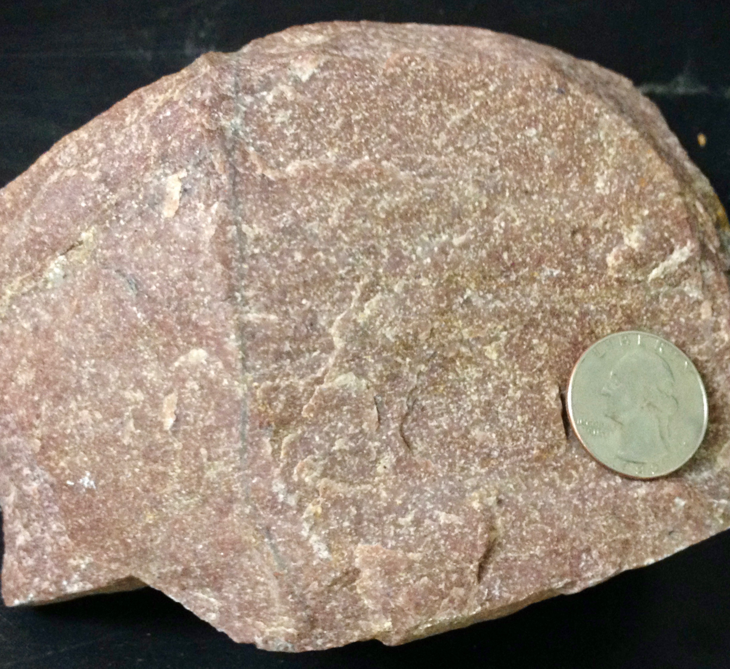 Crystallized rock with interlocking crystals.