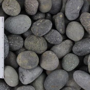 Close-up of black Mexican beach pebbles creating a pathway