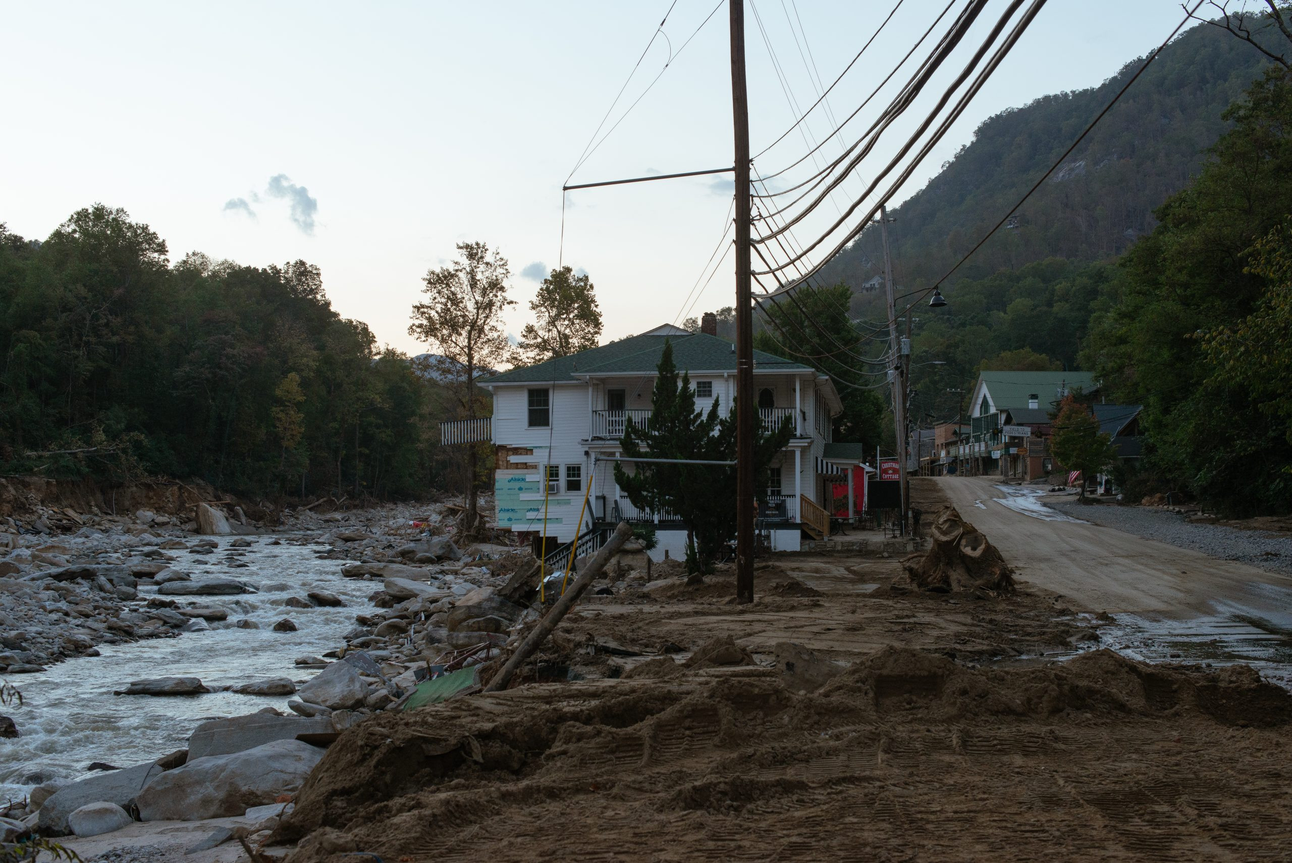 flood-damaged home along roadway into downtown Chimney Rock