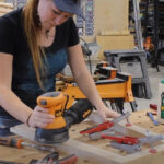 Sanding and cleaning up the details of the rocking chair frame