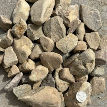 River rock used as mulch around trees
