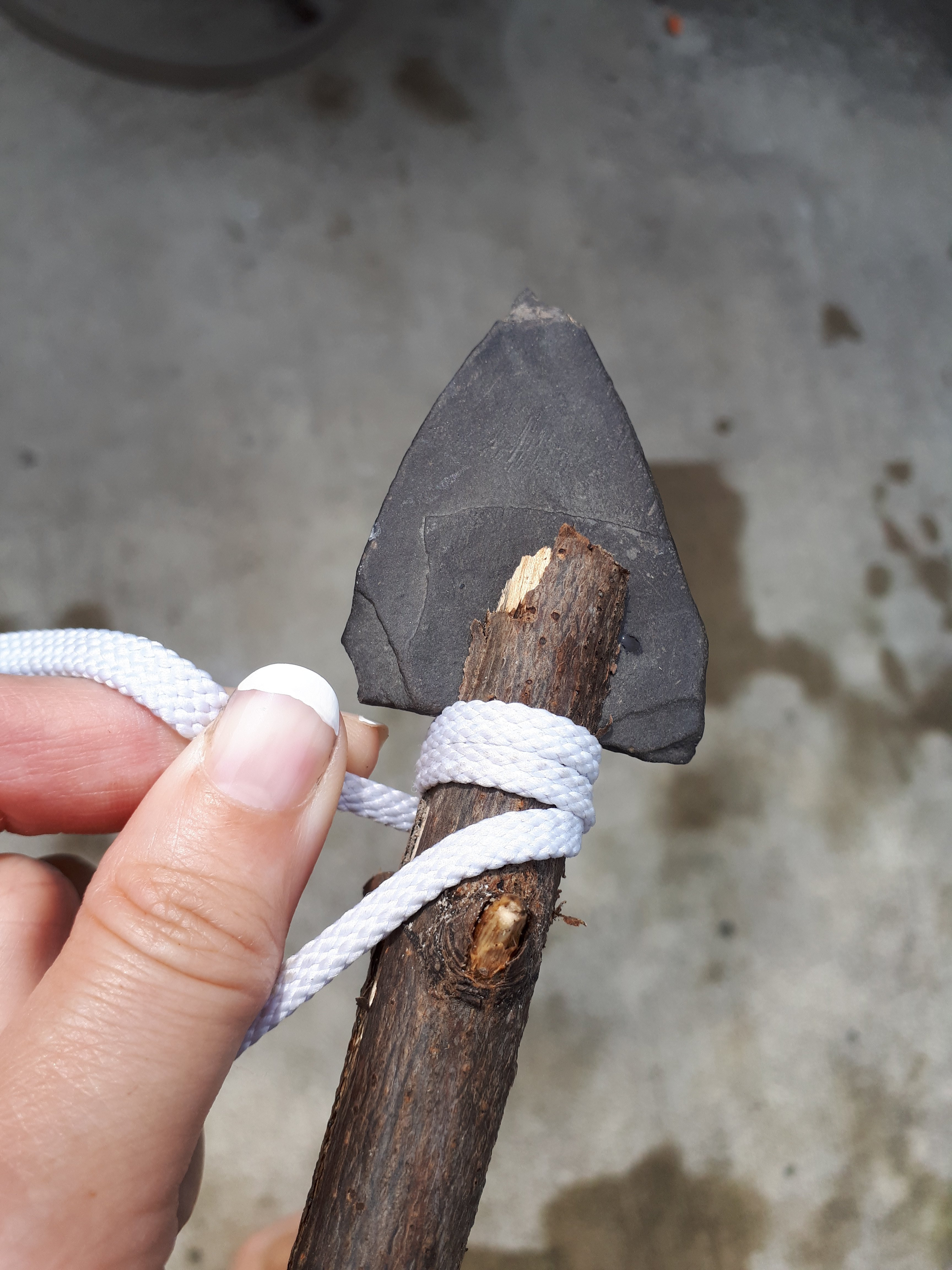 Wrap the string tightly around the stick