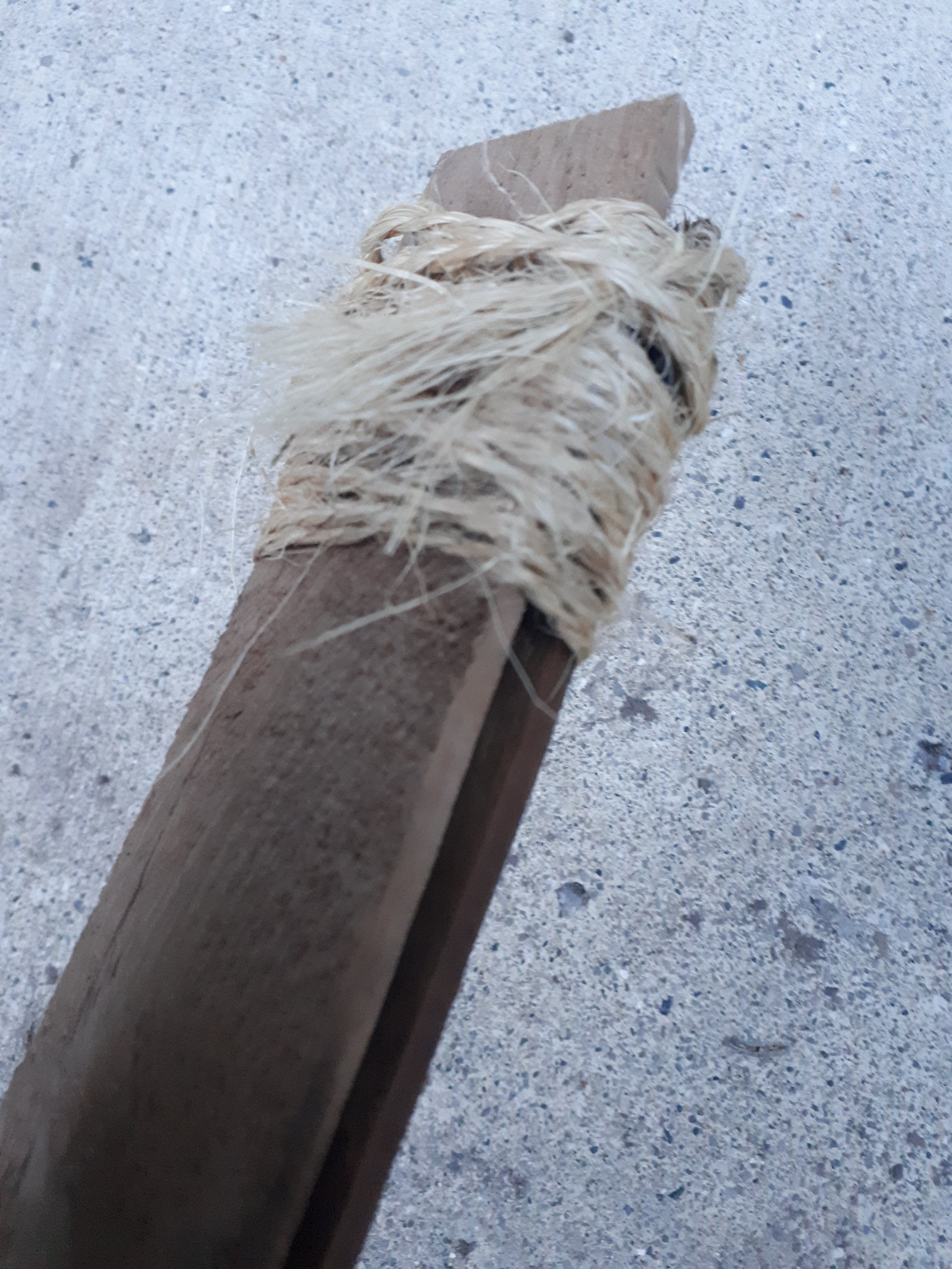 Wrap rope around both ends of the stick